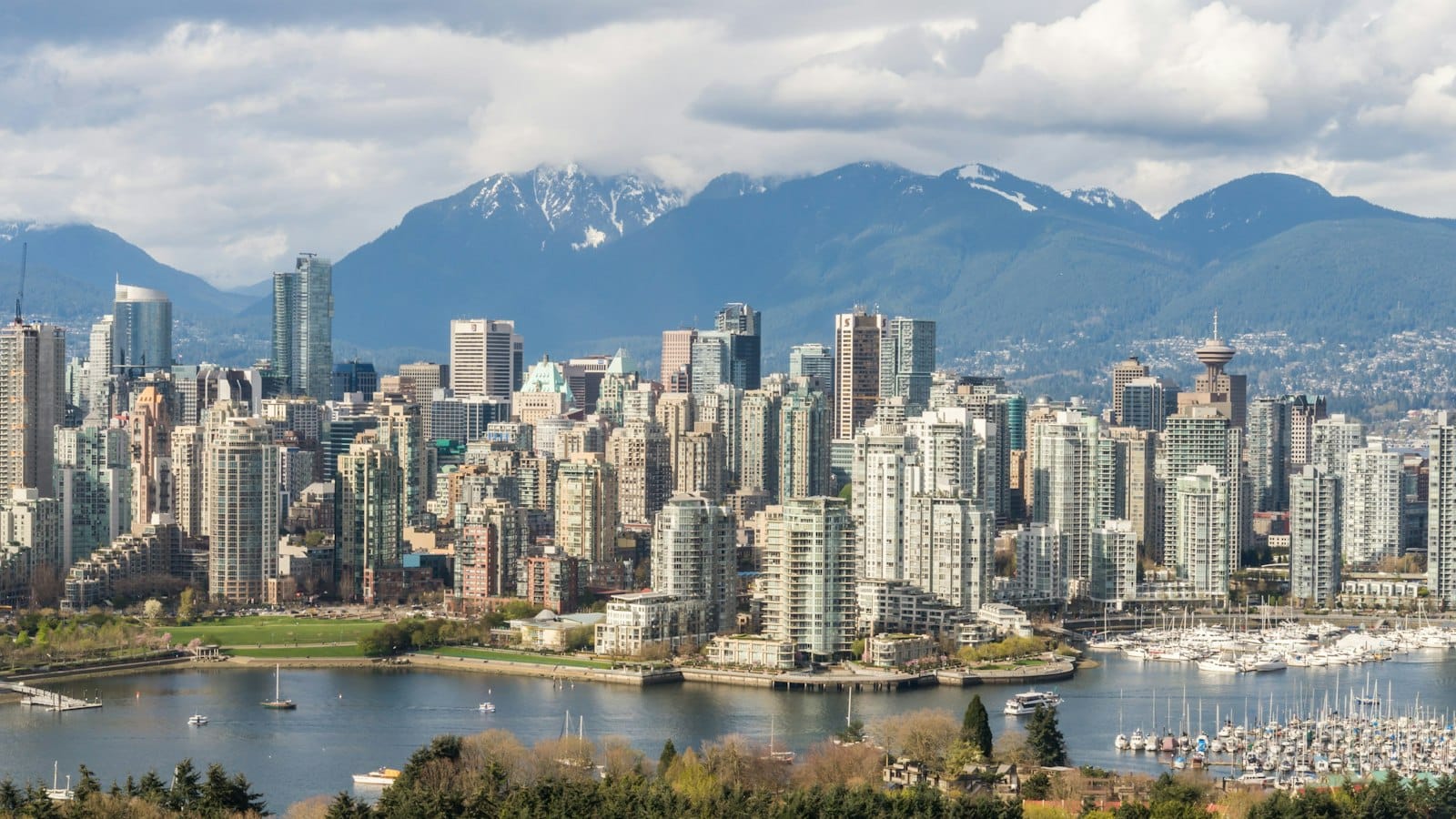 Downtown Vancouver skyline over False Creek with the North Shore mountains behind